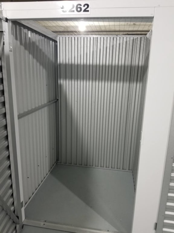 the inside of a steel container with the door open