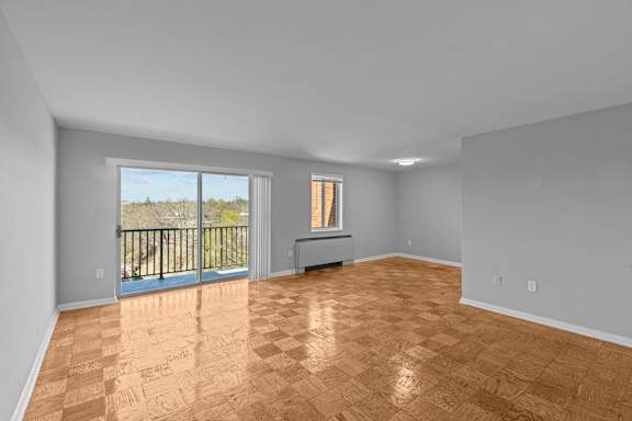 A room with wooden flooring and a balcony at Kensington House, Kensington, Maryland