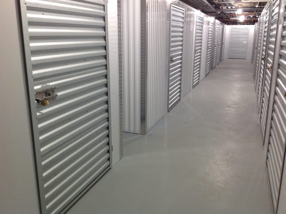 a row of metal doors in a storage room