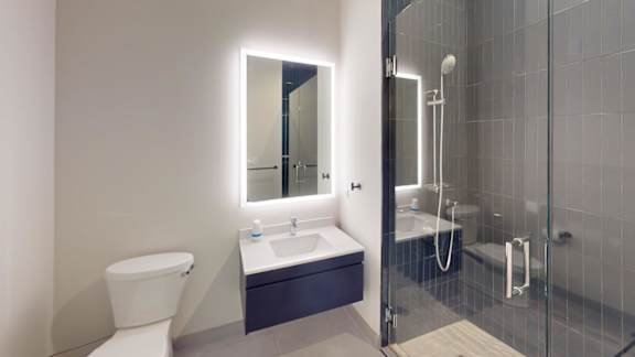a bathroom with a sink toilet and a shower