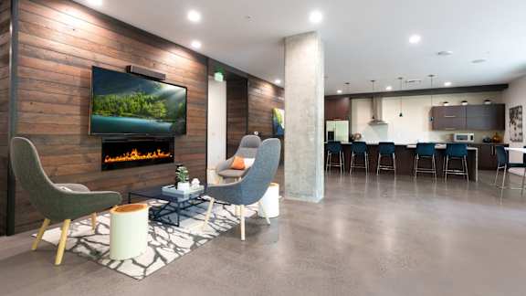A modern living room with a fireplace and a television.