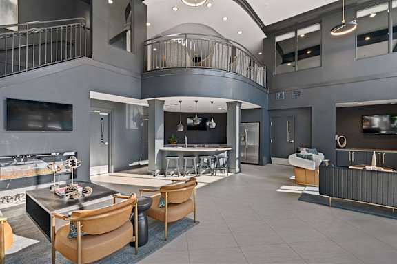 A modern open-concept living space with a kitchen, dining area, and a balcony.