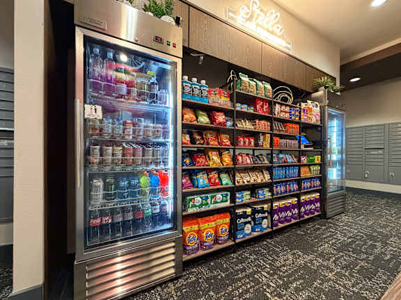 A vending machine with a variety of drinks and snacks.