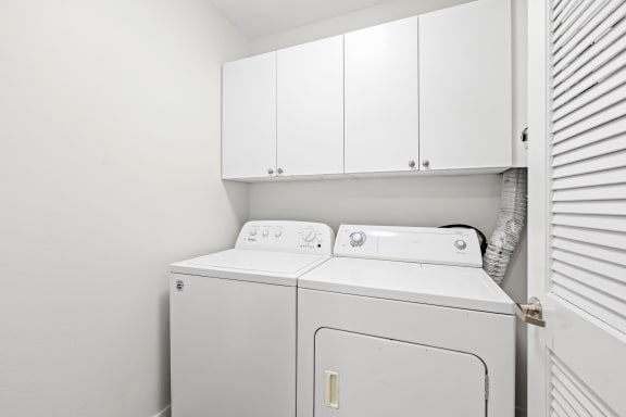 a laundry room with a washer and dryer