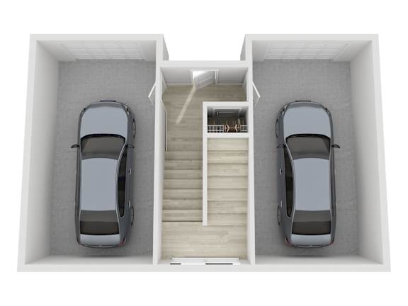 Two cars are parked in a garage with a staircase in the middle.