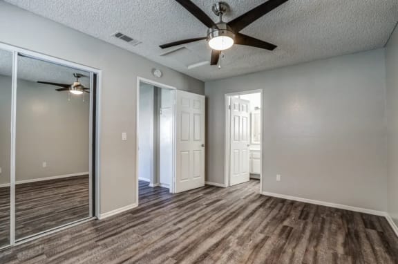 an empty living room with a ceiling fan at Aspire Seneca, Victorville, 92392