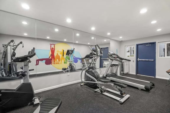 a gym with treadmills and other exercise equipment at Aspire Corona, Corona, 92882