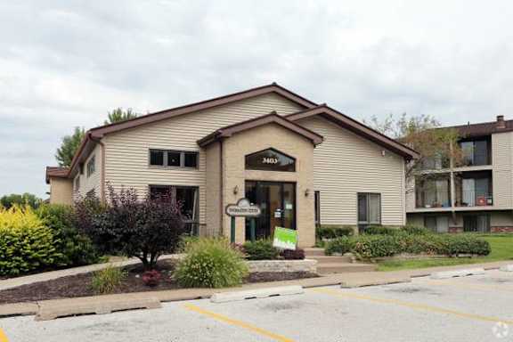 A building with a brown roof and a sign that says "1500" on it.