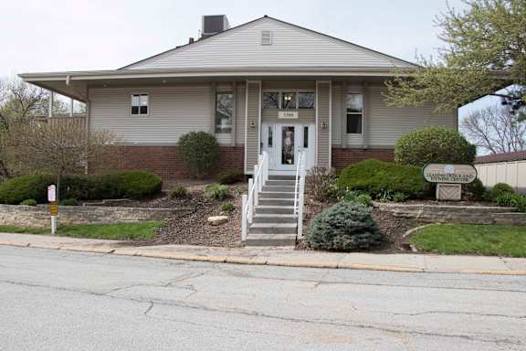 A house with a grey roof and a white door.