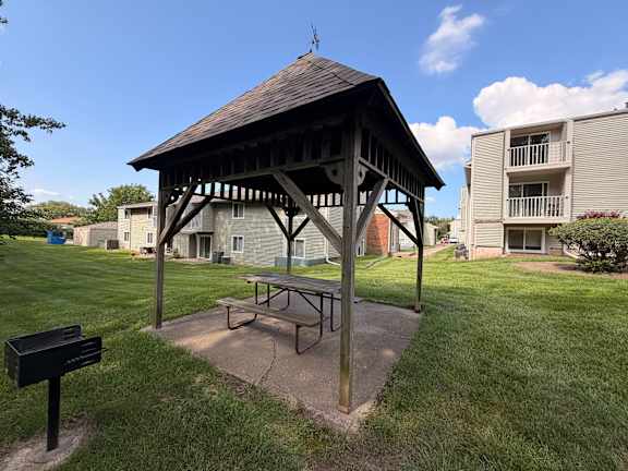 Covered picnic shelter with table and grill at Winding Hills Apartments, Iowa, 52807