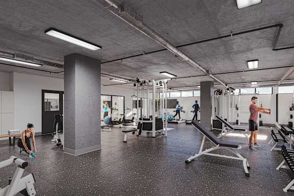 A gym with people working out and various equipment.