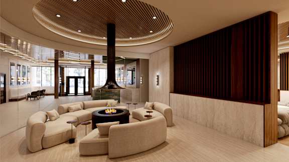 a lobby with couches and chairs and a fireplace at The Woods at 180 Kanata Avenue, Kanata, ON