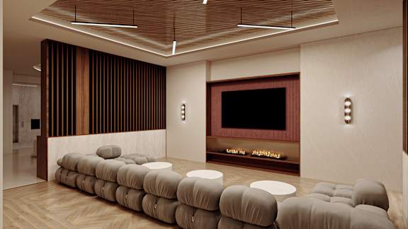 a living room with a tv and a bunch of chairs at The Woods at 180 Kanata Avenue, Kanata, K2K 3L9