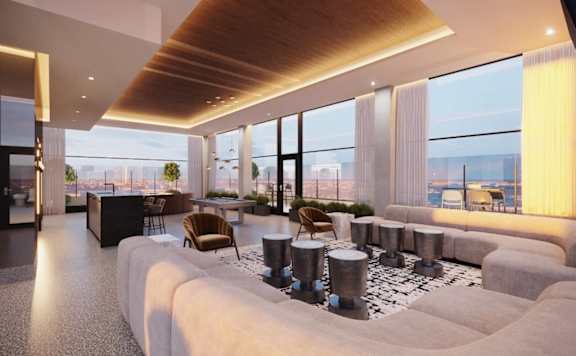 A modern living room with a large window overlooking the city.