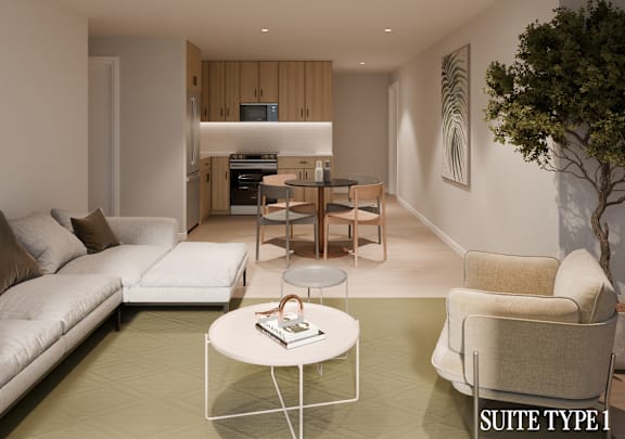 A modern living room with a white sofa, a coffee table, and a dining table.