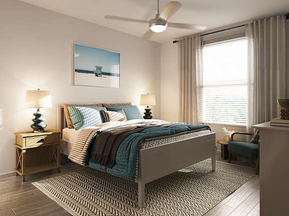 A bedroom with a bed, a chair, and a painting on the wall at Allegra at Cocoa in Cocoa, FL, 32926