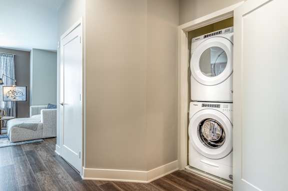 Stacked washer and dryer in closet nook at Inwood at Renaissance Square Apartments, New Jersey, 08053