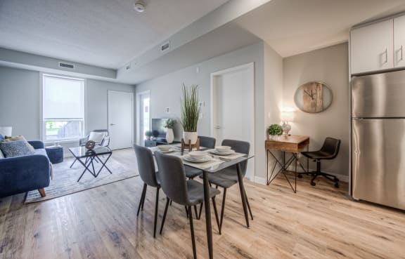 an open living room and dining room with a table and chairs