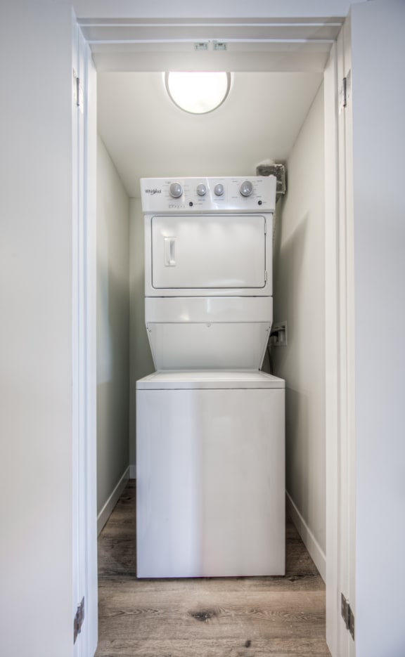 a washer and dryer in a small laundry room