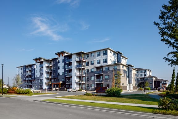 a large apartment building on the corner of a street