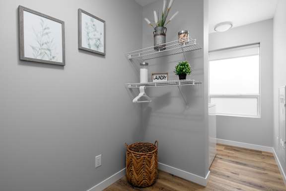 A laundry sign is on a shelf in a room.