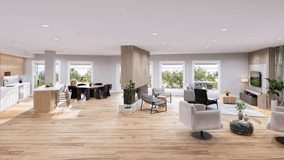 A modern living room with a dining area and kitchen in the background.
