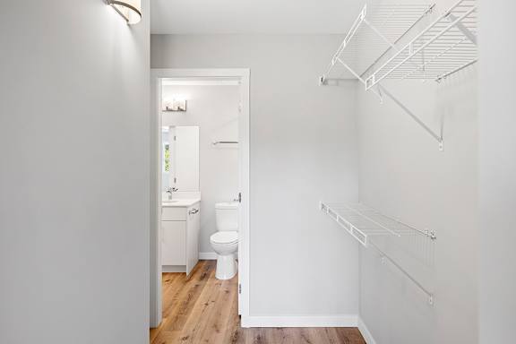 A white bathroom with a toilet and sink.