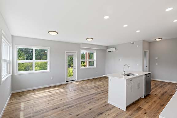 A kitchen with a white cabinet and a sink.