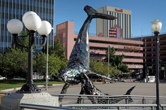 a statue of a whale in front of a city street at The Onyx at 695, Nevada