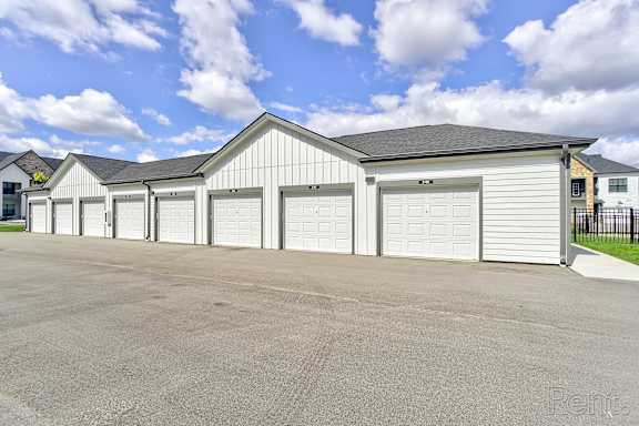 A row of garage doors are closed. at The BLVD at Wilson Crossings, Wyoming, MI