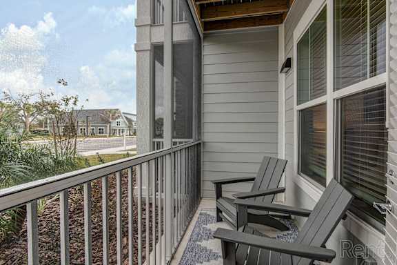 Two chairs are on a porch at Standard441 Luxury Apartments, Lady Lake, FL, 32159