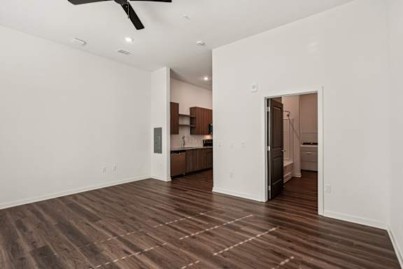 A room with a ceiling fan and wooden flooring at The Stadler Luxury Apartments, Bradenton