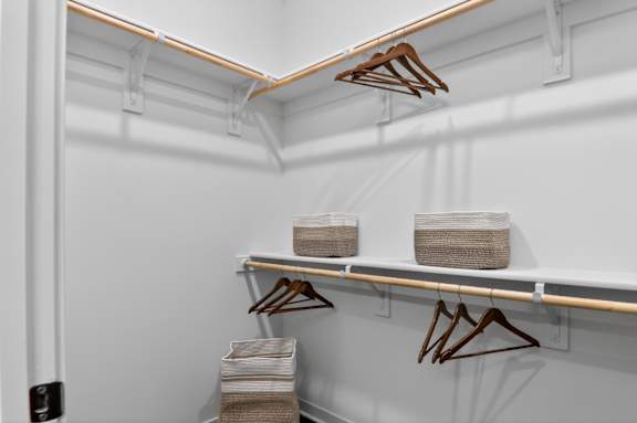 Clothes hangers on a white wall.at The Logan Luxury Apartments, Idaho, 83651