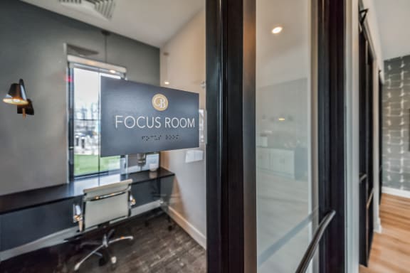 a focus room with a desk and a sign on the door at The BLVD at Wilson Crossings, Wyoming, MI 49418
