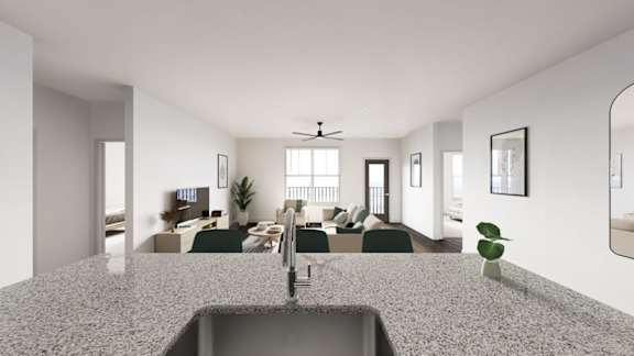 A modern kitchen with a granite countertop and a sink. at The Logan Luxury Apartments, Nampa, Idaho