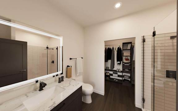 A bathroom with a white sink and a toilet.