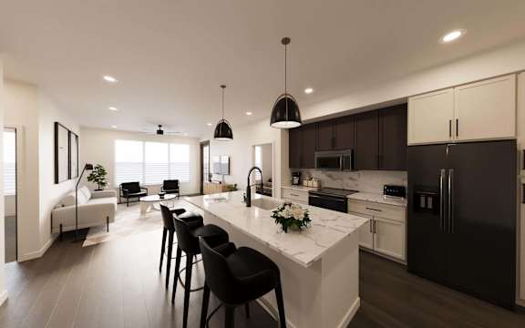 A modern kitchen with a marble countertop and black bar stools.