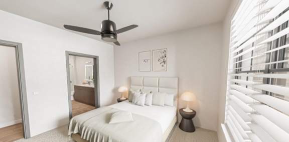 A bedroom with a bed, a ceiling fan, and a window with blinds.