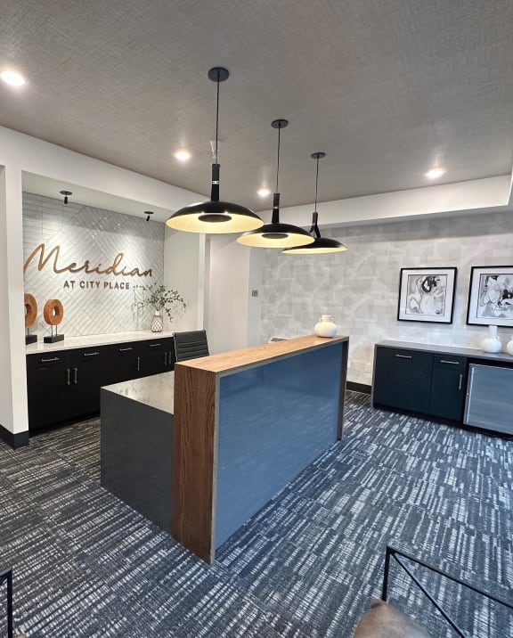 a view of a lobby with a reception desk and lights at Meridian at CityPlace, Woodbury