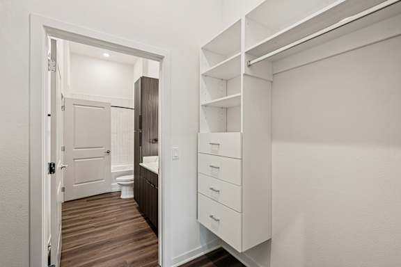 A white bathroom with a toilet and sink at The Stadler Luxury Apartments, Bradenton, FL 34210