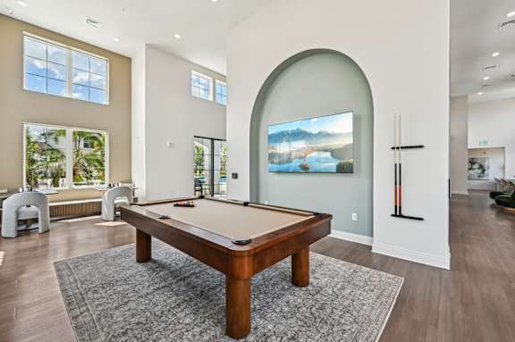 A pool table in a room with a painting on the wall at The Hadley - North Port, FL Apartments, North Port, FL