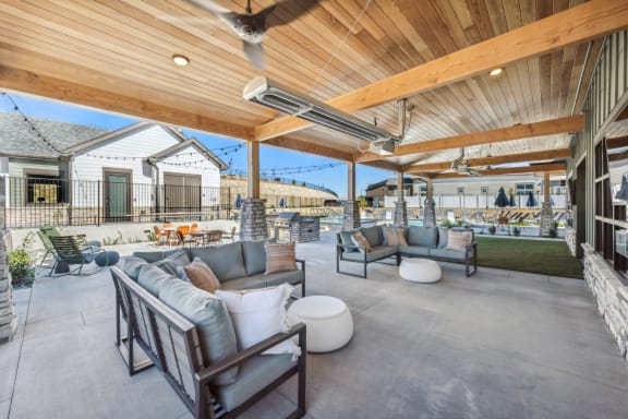 a patio with couches and chairs and a wooden ceiling at Citadel at Castle Pines, Castle Pines, CO, Colorado