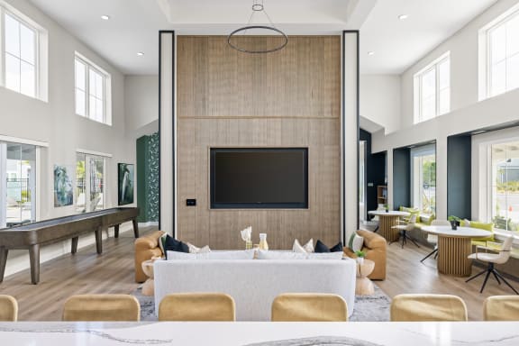 a living room with a large couch and a television at Palm Grove in Ellenton, FL 34222