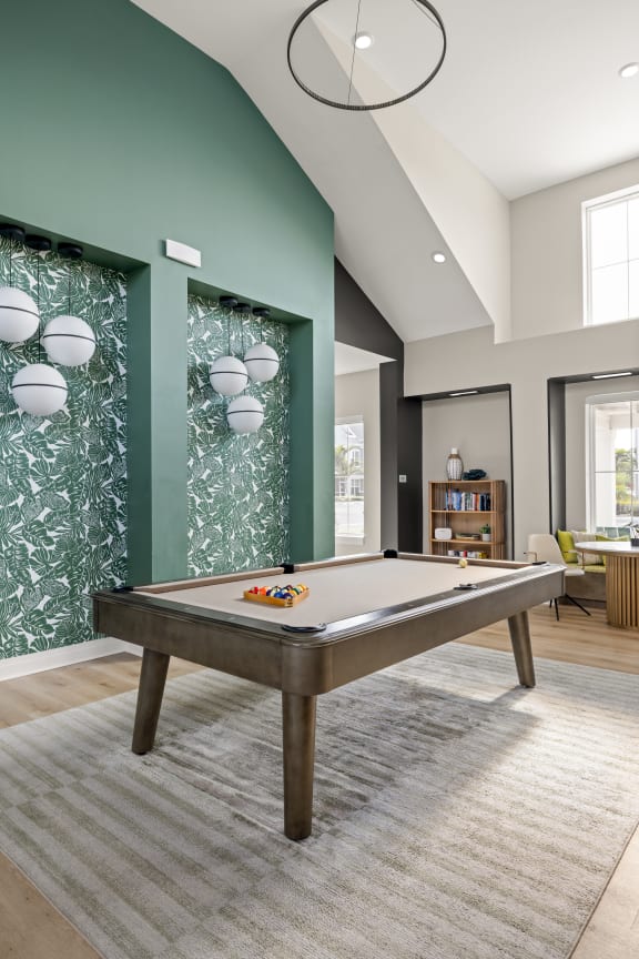 a game room with a pool table in a house at Palm Grove in Ellenton, FL 34222