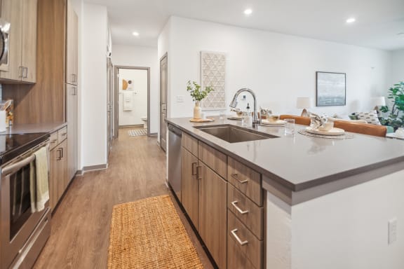 a large kitchen with a sink and counter top in a new home  at Palm Grove, Florida