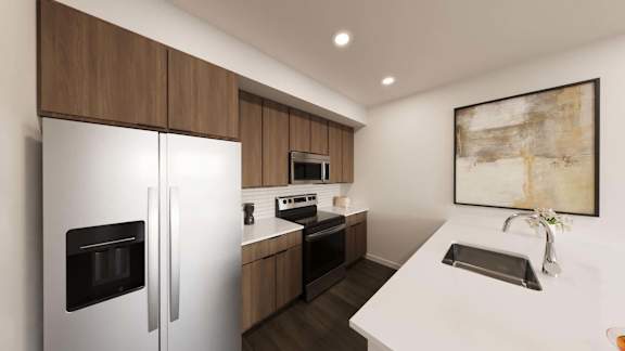 Modern kitchen with white countertops and wood cabinets at The Maverick Luxury Apartments, Monument, CO 80132