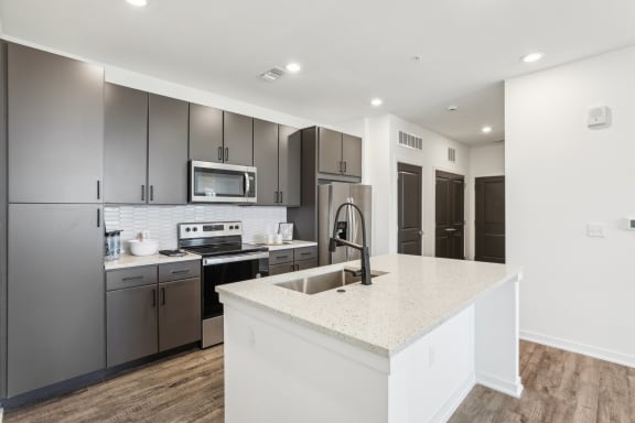 a kitchen with a marble floor and black and white at Drift, Daytona Beach, FL, 32117