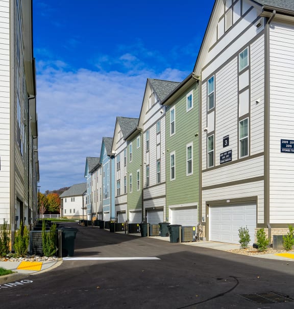 a row of houses with different colored windows  at Oakbrook Townhomes, Franklin