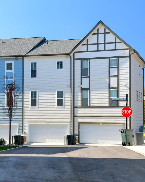 a white house with a stop sign in front of it  at Oakbrook Townhomes, Franklin, 37067