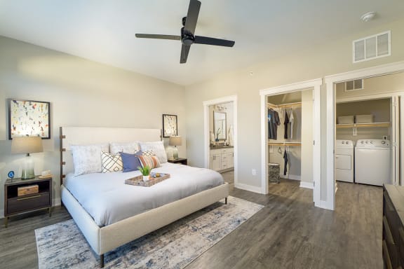 a bedroom with a bed and a ceiling fan  at Oakbrook Townhomes, Franklin, TN, 37067